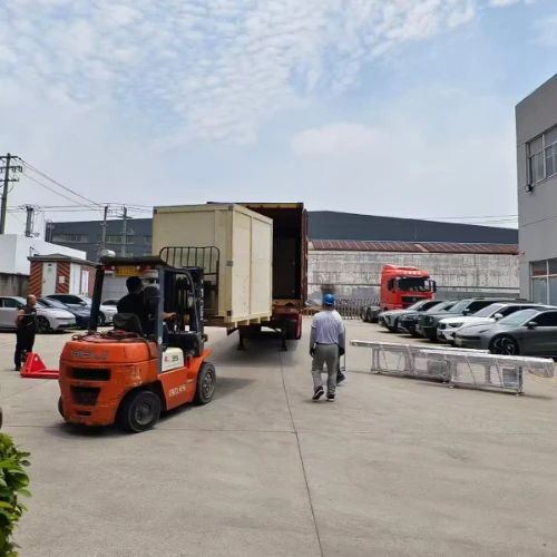 Forklift moving HAIFEI automated welding equipment to a shipping container outside the factory. Forklift moving HAIFEI automated welding equipment to a shipping container outside the factory.